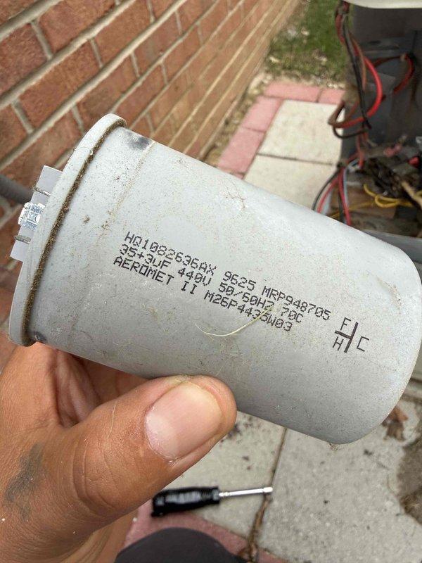 Completed Gold AC inspection on 10+ year old air conditioning unit located at basement level. Performed comprehensive system evaluation including electrical testing with clamp meter, recording voltage readings of 242.9V and amperage of 81.6A. Inspected and tested dual-run capacitor rated at 35+5 MFD 370V, which showed signs of age-related wear and deterioration. All system components evaluated for proper operation, electrical connections verified secure, and outdoor condenser unit assessed for performance and safety compliance.