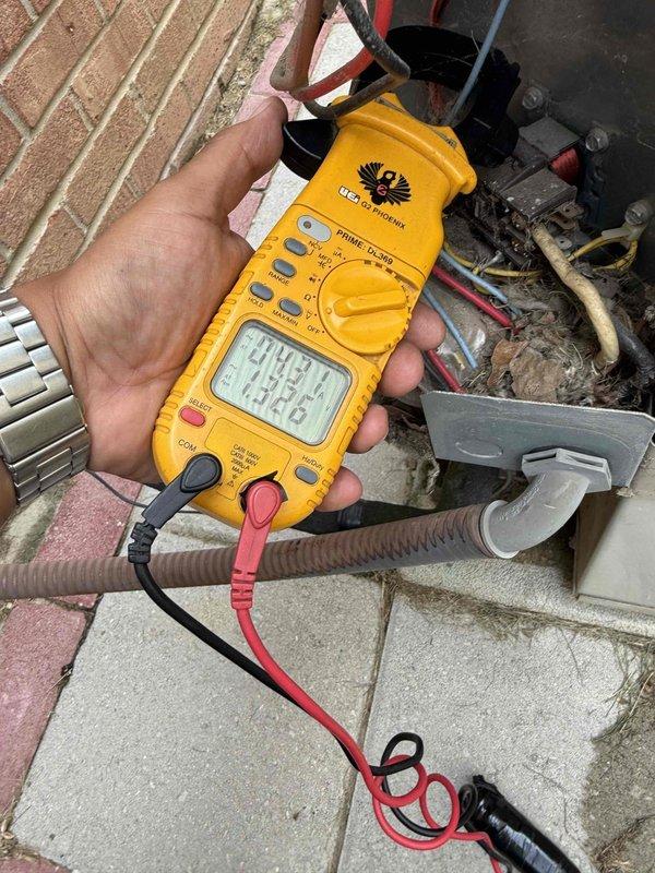Completed Gold AC inspection on 10+ year old air conditioning unit located at basement level. Performed comprehensive system evaluation including electrical testing with clamp meter, recording voltage readings of 242.9V and amperage of 81.6A. Inspected and tested dual-run capacitor rated at 35+5 MFD 370V, which showed signs of age-related wear and deterioration. All system components evaluated for proper operation, electrical connections verified secure, and outdoor condenser unit assessed for performance and safety compliance.
