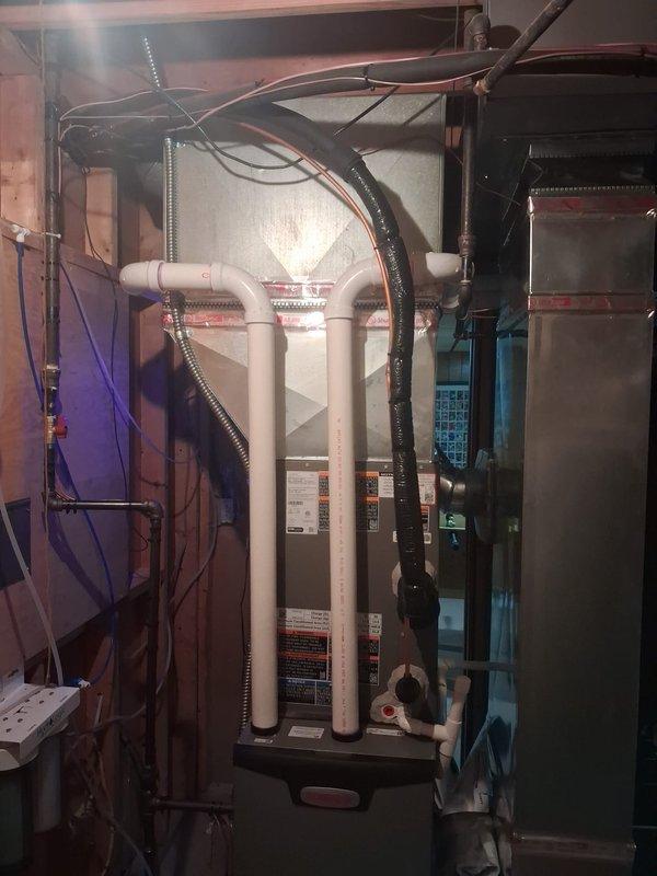 Completed full HVAC system installation including 70,000 BTU furnace and 3-ton air conditioning unit in left side yard location. Installed S40 thermostat, 500M humidifier, and APCO-1 air purification system with proper PVC intake and exhaust venting. Performed system flush, reconnected existing utilities, and verified all electrical and mechanical connections meet code requirements. Obtained necessary mechanical and electrical permits for installation. System tested and operational, with AHRI certification number 216726208 confirmed for utility rebate eligibility.