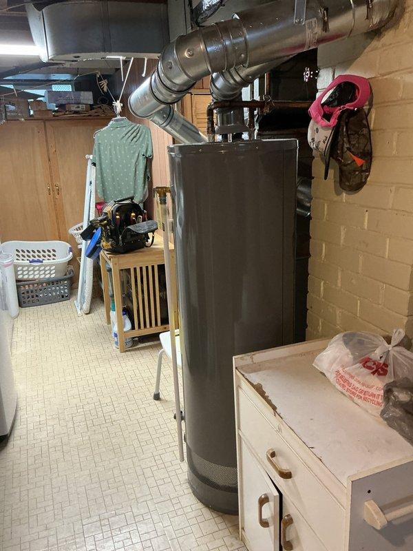 Responded to customer complaint of rattling noise coming through upstairs registers during system operation. Inspected 7-year-old furnace unit located in basement and associated ductwork. Examined all accessible duct connections, plenum attachments, and register boots for loose components or hardware. Verified system operational status with both heating and cooling modes functioning properly. Checked thermostat programming and confirmed proper system cycling. No loose components found within furnace cabinet or accessible ductwork that would account for reported noise. Advised customer that rattling may be originating from register grilles, duct hangers, or sections of ductwork not readily accessible from basement location and recommended monitoring for any changes in noise pattern or system performance.