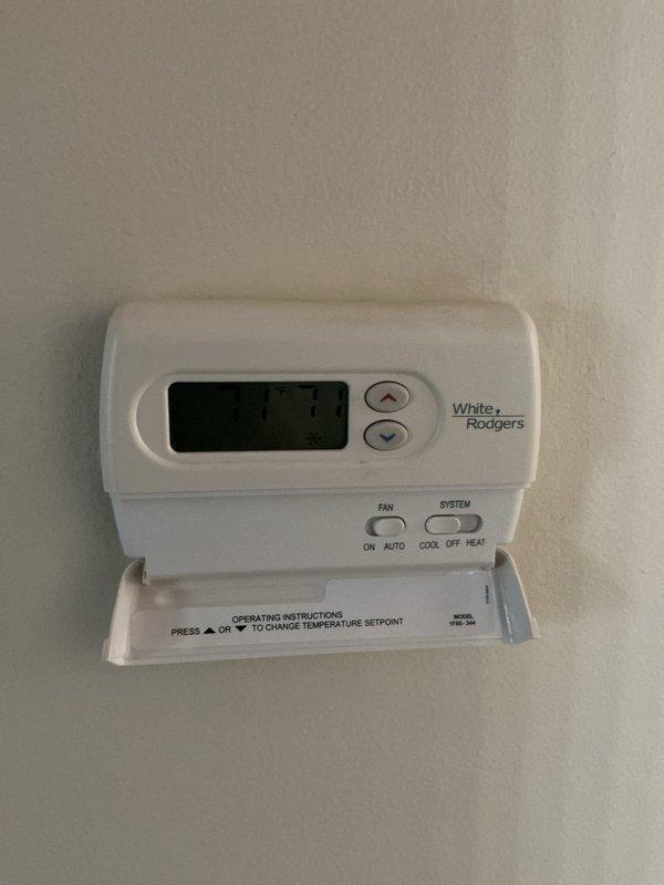 Responded to customer complaint of rattling noise coming through upstairs registers during system operation. Inspected 7-year-old furnace unit located in basement and associated ductwork. Examined all accessible duct connections, plenum attachments, and register boots for loose components or hardware. Verified system operational status with both heating and cooling modes functioning properly. Checked thermostat programming and confirmed proper system cycling. No loose components found within furnace cabinet or accessible ductwork that would account for reported noise. Advised customer that rattling may be originating from register grilles, duct hangers, or sections of ductwork not readily accessible from basement location and recommended monitoring for any changes in noise pattern or system performance.