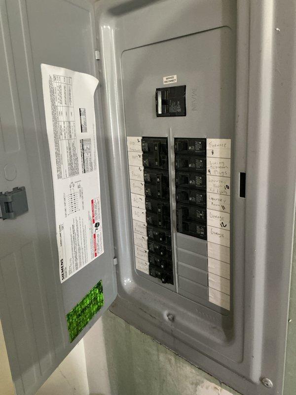 Conducted comprehensive site evaluation for whole home generator installation at residential property. Assessed existing electrical panel configuration, circuit breaker capacity, and available space for transfer switch integration. Evaluated natural gas meter location and utility infrastructure to determine optimal generator placement and fuel line routing. Documented protective bollard clearances and verified adequate space for generator unit installation while maintaining required utility access and safety zones.