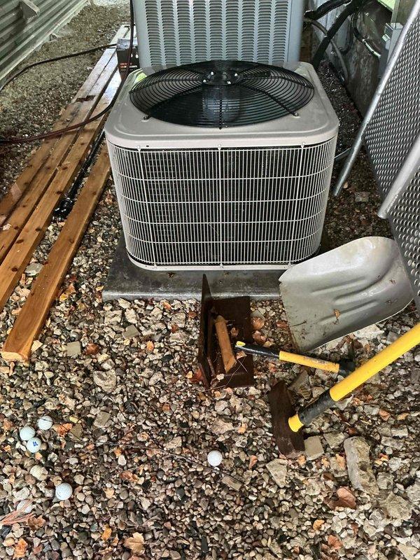 Responded to service call for central air conditioning system producing abnormal operating sounds. Performed comprehensive annual maintenance inspection on outdoor condensing units. Examined both AC units on-site, checking refrigerant levels, electrical connections, and mechanical components. Verified system operational status and cooling capability. Cleaned condenser coils, inspected fan motors and blades for proper operation, and tightened all electrical connections. Assessed gravel pad stability and unit mounting. System restored to normal operating parameters with no unusual noise detected upon completion. Recommended continued annual maintenance schedule to ensure optimal performance and longevity.