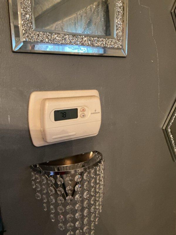 Conducted on-site evaluation for new air conditioning system installation in residential property with no existing AC equipment. Assessed current heating system infrastructure installed approximately 4-5 years ago, examined existing ductwork in basement mechanical area, and evaluated thermostat location and electrical requirements to provide comprehensive replacement estimate for complete AC system installation.
