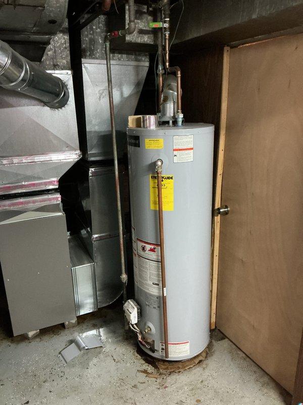 Responded to a basement water heater leak call. Upon inspection, found active leaking at the base of the tanked water heater with visible water staining on the concrete floor. Assessed the unit's condition, including all copper piping connections, pressure relief valve, and tank integrity. Documented the leak source and current installation setup, including connection points and surrounding plumbing infrastructure. Provided diagnostic findings and recommendations to the property owner for necessary repairs or replacement options.