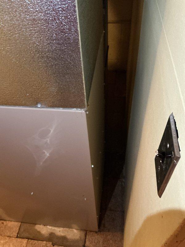Responded to urgent service call for non-operational furnace system affecting whole-house heating and cooling capabilities. Assessed 35-year-old original equipment installed in 1991, located in basement mechanical room. Documented existing furnace installation including cabinet unit, ductwork connections, filter housing, and associated copper and brass piping components. Provided comprehensive replacement estimate for complete HVAC system replacement due to equipment age and failure affecting both heating and air conditioning functionality.