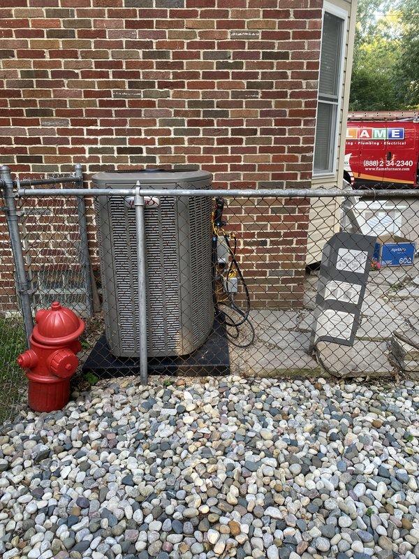 Completed full HVAC system installation including a 90,000 BTU furnace and 4-ton air conditioning unit with right-side configuration. Installed humidifier, S40 thermostat, and condensate pump with flush kit. Positioned outdoor condenser unit on platform with river rock base against brick exterior, ran refrigerant lines and electrical connections, and installed PVC venting system through foundation with proper trap configuration. Reconnected all utilities, obtained mechanical and electrical permits, and documented installation for utility rebate qualification under AHRI certificate 216723006.