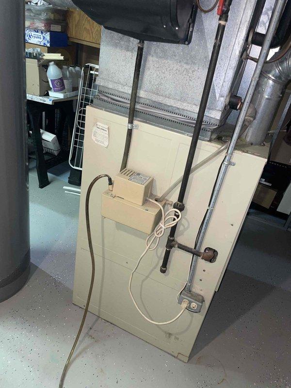 Provided estimate for complete HVAC system replacement in basement location. Existing 36-year-old natural gas furnace is non-operational and requires full system replacement including furnace and air conditioning components. Assessed current equipment configuration, ductwork connections, and utility access to determine proper sizing and installation requirements for new system.