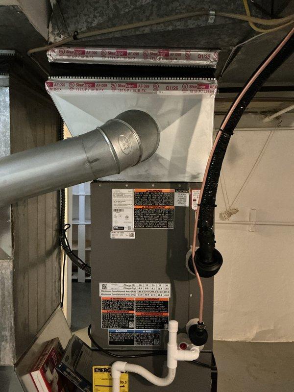 Completed installation of 3-ton air conditioning system with matching evaporator coil on existing furnace unit in basement location. Installation included proper refrigerant line connections with insulated copper tubing, PVC condensate drainage, electrical reconnection, and all necessary ductwork modifications to integrate new coil into existing plenum. Mechanical and electrical permits were requested for this rear-discharge unit installation, and all components were tested for proper operation upon completion.