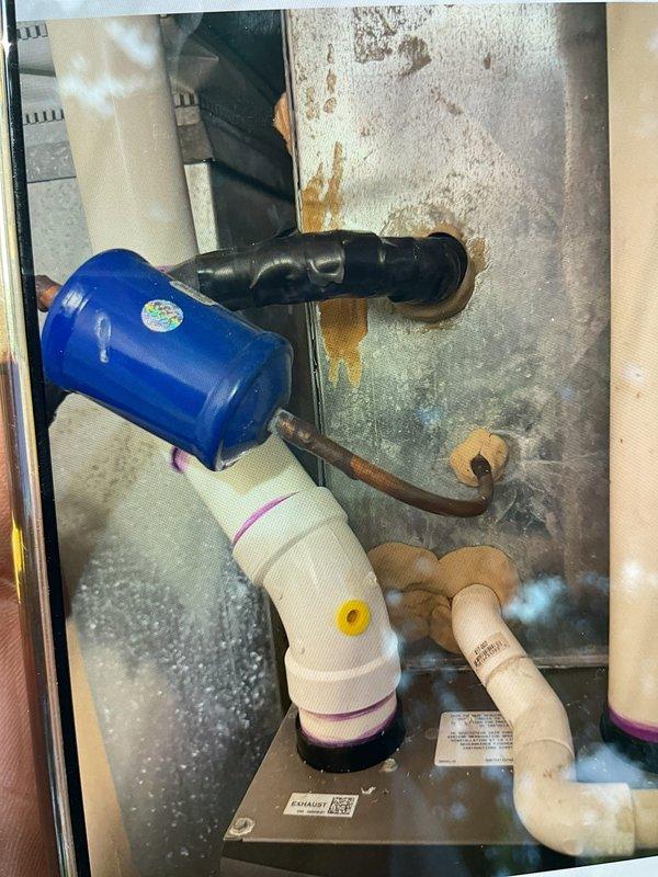 Completed comprehensive Gold AC Inspection on a 14-year-old HVAC system with air handler located in basement. System was operational at time of inspection. Performed thorough visual assessment of all accessible components, including air handler cabinet, refrigerant lines, condensate drain system, and thermostat controls. Documented evidence of significant rust and corrosion on interior cabinet surfaces, which may require future monitoring for structural integrity. Inspected dual thermostat setup including Honeywell mechanical unit and digital programmable control. Verified proper operation of PVC condensate drainage system with associated plumbing components and safety devices. Photographed equipment condition for maintenance records. System currently functioning as designed with no immediate service requirements identified during inspection.
