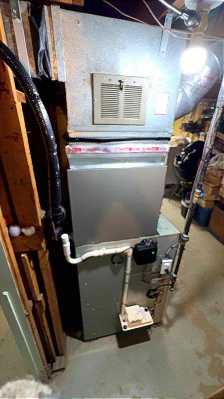 Completed installation of 2-ton air conditioning system with new evaporator coil in rear yard location. Obtained mechanical, electrical, and AC permits prior to installation. Successfully reconnected all necessary components including refrigerant lines, condensate drainage via PVC piping, electrical connections, and ductwork integration with existing furnace system. System tested and confirmed operational upon completion.