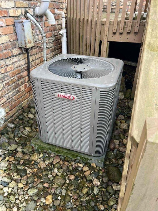 Completed comprehensive Gold AC Inspection and tune-up on a 10-year-old Lennox cooling system with indoor air handler located in basement mechanical room and outdoor condenser unit positioned between brick wall and privacy fence. Performed full system evaluation including visual inspection of indoor components, PVC condensate drain lines, refrigerant line set, and electrical connections at both indoor and outdoor units. Inspected outdoor condenser unit including coil condition, fan operation, electrical disconnect, and mounting pad stability. System operating within normal parameters with no issues identified during routine maintenance visit.