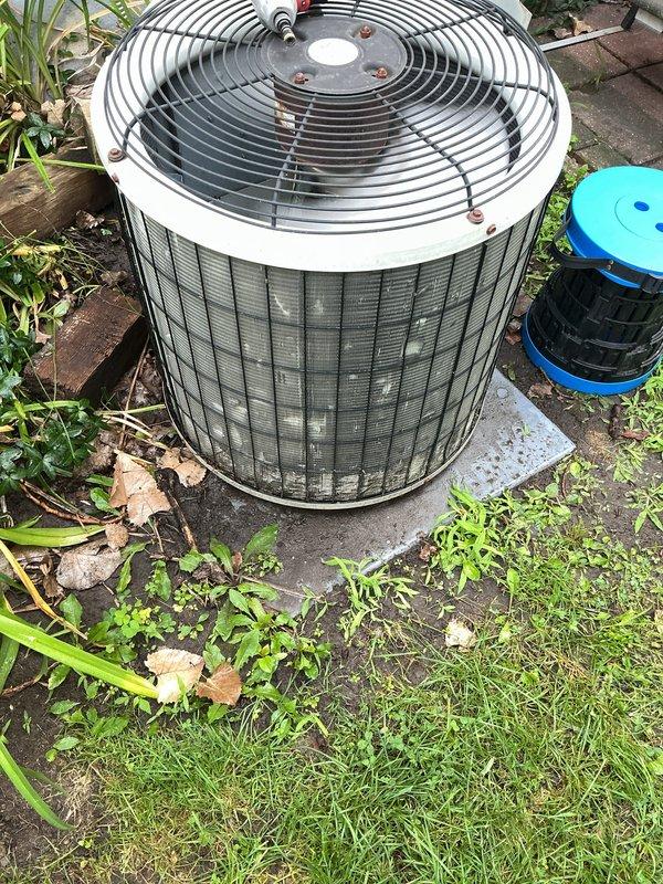 Completed comprehensive air conditioning tune-up and inspection on 17-year-old cooling system with outdoor condenser unit located on concrete pad. Performed standard maintenance protocol including visual inspection of condenser cabinet, fan assembly, and exterior coil fins, verified unit operational status, and assessed overall system condition. Equipment found to be functioning with normal wear consistent with age, and homeowner advised of system status upon completion.