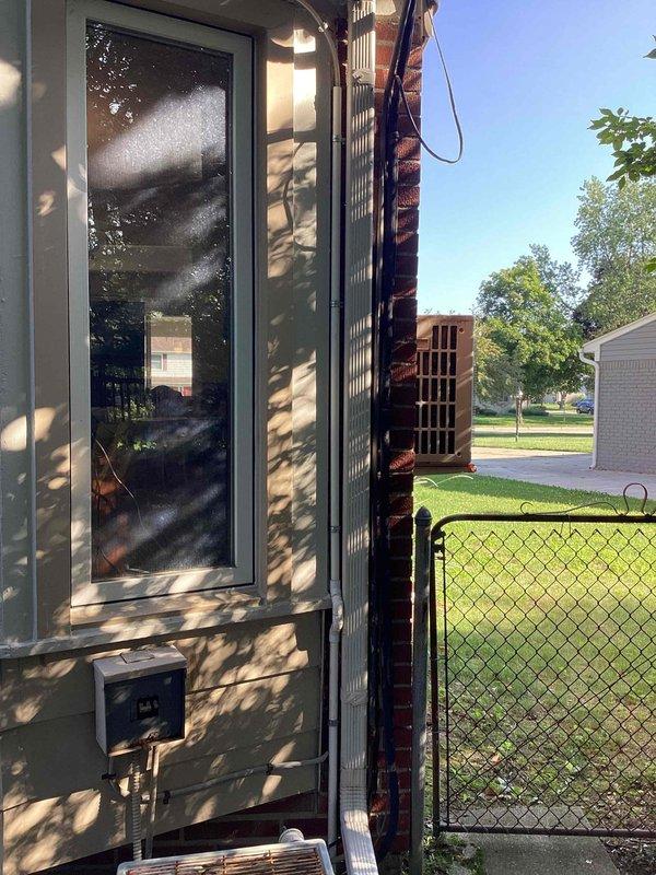 Conducted on-site evaluation for complete air conditioning system replacement. Existing 35-year-old unit located on second floor ceiling has reached end of service life and requires full replacement. Assessed exterior condensing unit with exposed copper refrigerant lines and evaluated attic-mounted air handler and ductwork system. Documented existing installation conditions including structural framing, insulation clearances, and chase configuration to determine proper sizing and installation requirements for new equipment. Provided comprehensive replacement estimate including equipment specifications and installation scope.