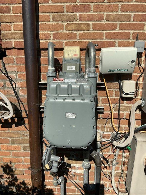 Completed estimate for replacement of non-operational Generac 37 KW liquid-cooled standby generator located in backyard against brick wall exterior. Existing unit is aged and requires full replacement. Assessed current installation including concrete pad, gas meter connections, electrical conduit routing, and clearances from structure. Evaluated existing infrastructure for compatibility with new generator installation, including gas line capacity, transfer switch accessibility, and proper ventilation requirements. Provided comprehensive replacement proposal with equipment specifications and installation scope.