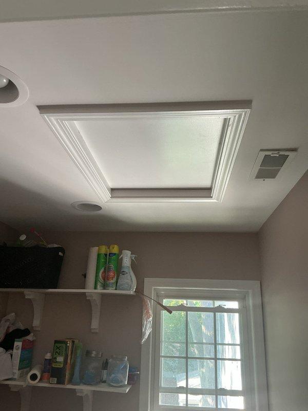 Responded to no cooling complaint on 8-year-old residential air conditioning system located in attic. Upon arrival, verified thermostat settings and confirmed unit was calling for cooling but not achieving setpoint. Performed visual inspection of attic-mounted equipment and documented system conditions with photos. Thermostat display showed temperature differential indicating cooling demand. No detailed troubleshooting or repairs were completed during this visit.