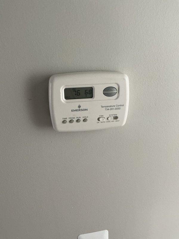Responded to no cooling complaint on 8-year-old residential air conditioning system located in attic. Upon arrival, verified thermostat settings and confirmed unit was calling for cooling but not achieving setpoint. Performed visual inspection of attic-mounted equipment and documented system conditions with photos. Thermostat display showed temperature differential indicating cooling demand. No detailed troubleshooting or repairs were completed during this visit.