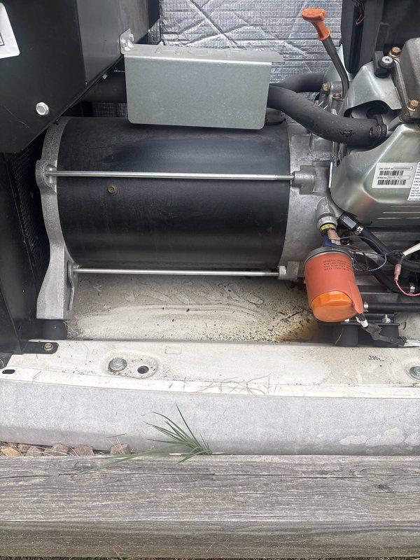 Performed routine maintenance inspection on Generac standby generator unit. Conducted visual assessment of all accessible components including blower assembly, mounting hardware, and electrical connections. Inspected condensate drainage system and noted accumulated debris in base pan area requiring attention. Verified operational status of motor assembly and associated wiring connections. Documented equipment condition through photographic records showing blower housing, internal mechanical components, and mounting configuration. Unit confirmed operational at time of service.