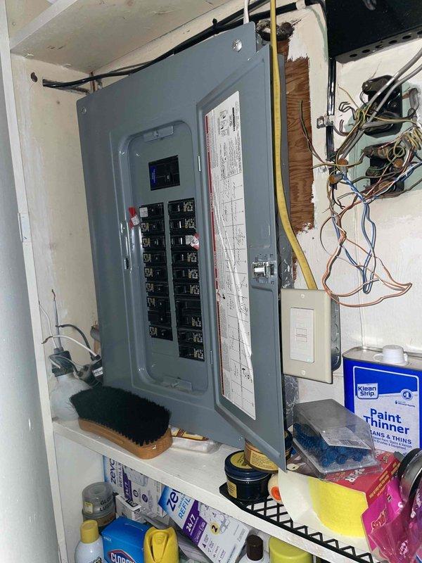 Conducted comprehensive assessment for whole-house HVAC system replacement, evaluating existing 26-year-old furnace located on first floor near rear of residence and determining requirements for new central air conditioning installation where none currently exists. Inspected electrical panel capacity and wiring configuration to verify adequate power supply for new heating and cooling equipment, photographed existing electrical infrastructure including circuit breaker arrangement and available connections to ensure proper system integration during installation phase.