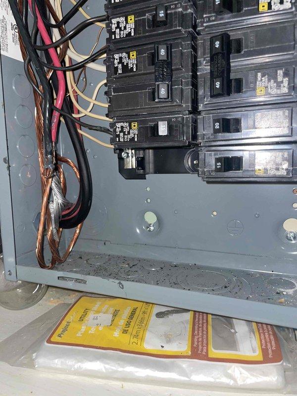 Conducted comprehensive assessment for whole-house HVAC system replacement, evaluating existing 26-year-old furnace located on first floor near rear of residence and determining requirements for new central air conditioning installation where none currently exists. Inspected electrical panel capacity and wiring configuration to verify adequate power supply for new heating and cooling equipment, photographed existing electrical infrastructure including circuit breaker arrangement and available connections to ensure proper system integration during installation phase.