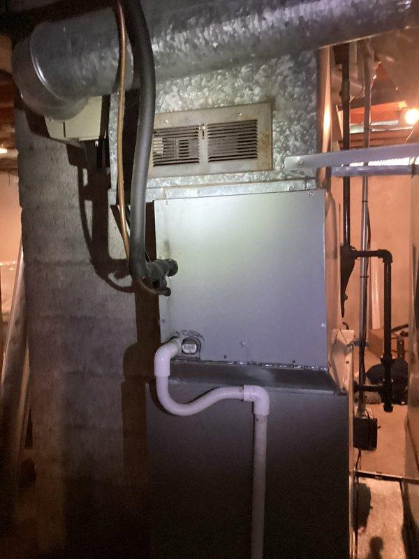 Performed comprehensive inspection of 17-year-old R22 cooling system located in basement. Evaluated existing HVAC equipment including furnace, air handler, and associated ductwork to provide replacement estimate. Documented current system configuration, including flexible ductwork installation, PVC condensate drainage, and overall equipment condition to determine complete replacement requirements for aging refrigerant system.