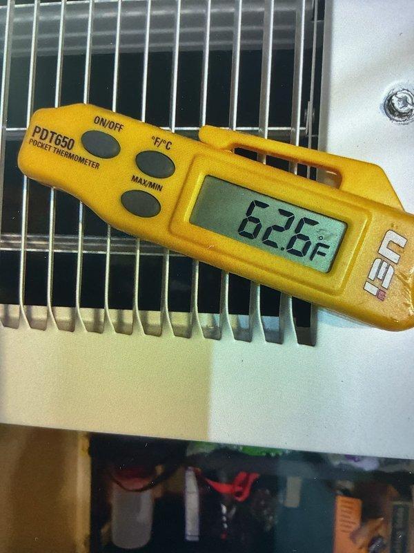Responded to callback for one-year-old AC system in basement with no cooling after previous service visit. Upon arrival, measured evaporator coil temperature at 62.6°F, indicating insufficient cooling performance. Inspected electrical connections at junction box and verified proper wiring and power supply to unit. Documented system conditions with temperature readings and electrical components for further diagnostics to resolve ongoing cooling issue.