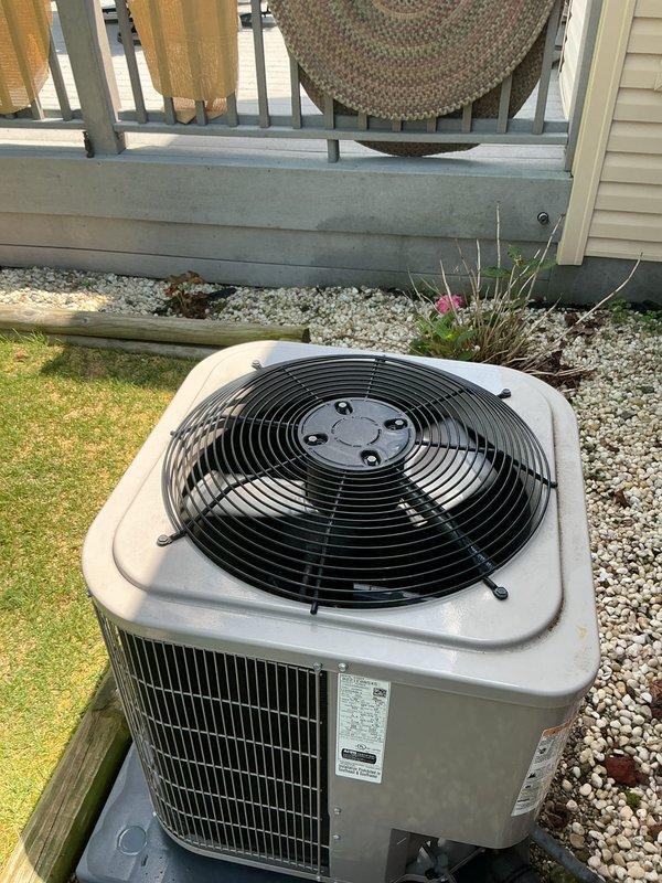 Completed comprehensive Gold AC Inspection on a six-year-old residential air conditioning system located in the backyard. Performed full preventative maintenance tune-up including inspection of condenser unit, verification of electrical connections at disconnect box, assessment of cabinet condition and coil fins, confirmation of proper unit leveling on concrete pad, and evaluation of overall system operation. Unit showed normal weathering consistent with age and outdoor exposure, with no operational issues identified. All components functioning within normal parameters, and system deemed in good working order for continued service.