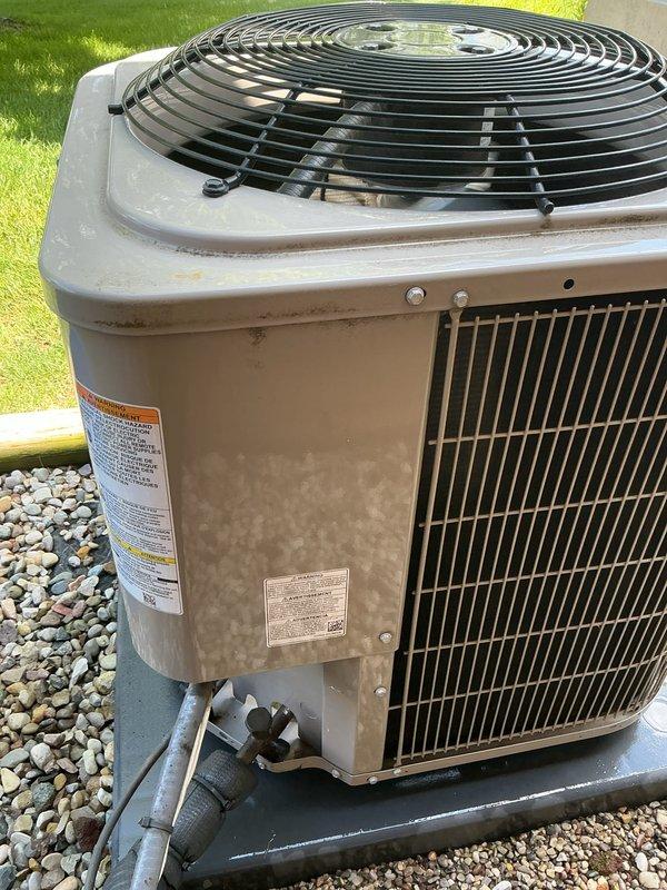 Completed comprehensive Gold AC Inspection on a six-year-old residential air conditioning system located in the backyard. Performed full preventative maintenance tune-up including inspection of condenser unit, verification of electrical connections at disconnect box, assessment of cabinet condition and coil fins, confirmation of proper unit leveling on concrete pad, and evaluation of overall system operation. Unit showed normal weathering consistent with age and outdoor exposure, with no operational issues identified. All components functioning within normal parameters, and system deemed in good working order for continued service.