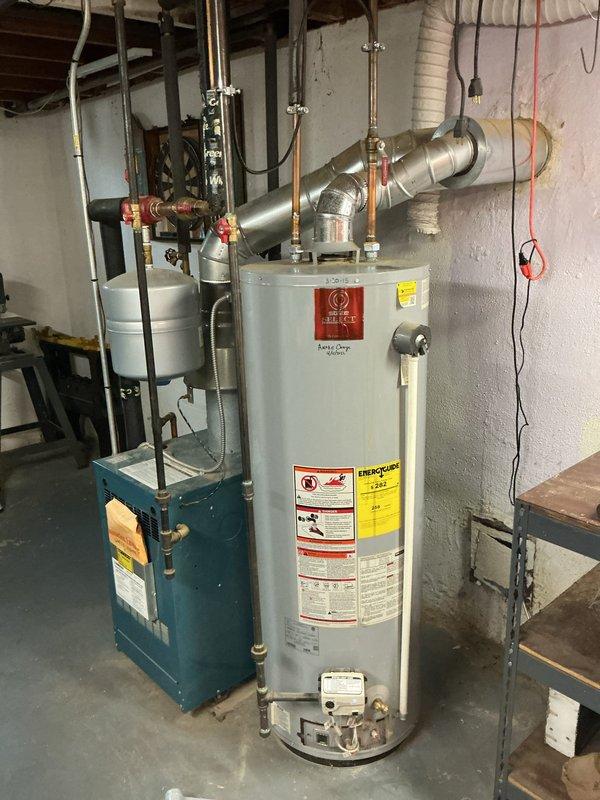 Responded to service call for tanked water heater that had previously gone out and was relit by homeowner. Performed comprehensive system inspection to verify safe and proper operation. Examined water heater unit, checking pilot light assembly, thermocouple, gas valve operation, and burner performance. Inspected all plumbing connections at top of unit, including hot and cold water lines, temperature and pressure relief valve, and shut-off valves for leaks or corrosion. Verified proper venting and flue pipe installation. Tested water meter assembly and main water supply connections for proper flow and pressure. Confirmed all safety labels and warnings were visible and intact. Found system operating within normal parameters with no immediate safety concerns or mechanical deficiencies requiring repair. Unit cycling properly and maintaining temperature setpoint.