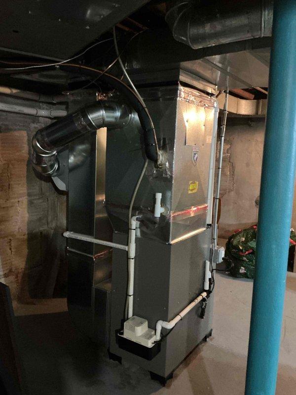 Completed installation of 70,000 BTU furnace system in basement mechanical room, including integration of humidifier unit and reconnection of existing ductwork. Obtained mechanical and electrical permits prior to installation and coordinated utility rebate application. Installed all necessary copper piping, PVC condensate drainage, electrical connections to main panel, and verified proper operation of all system components upon completion.