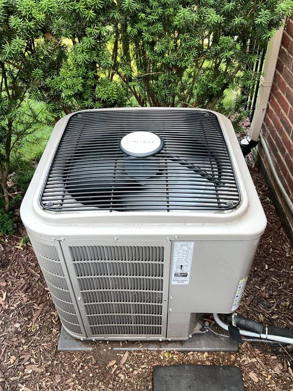 Completed comprehensive Gold AC Inspection on a 9-year-old residential air conditioning system with outdoor condensing unit and basement-located air handler. Performed thorough visual inspection of both outdoor and indoor components, verified proper operation of all equipment, examined condenser coil fins and cabinet condition, inspected refrigerant line connections and condensate drainage system, and documented equipment condition through photographic records. All components found operating within normal parameters with no immediate service needs identified.