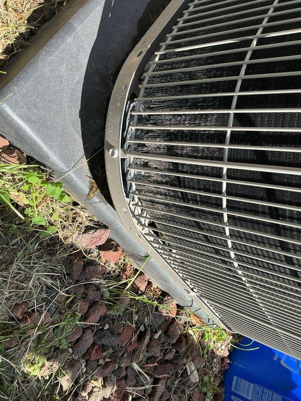 Completed annual preventive maintenance inspection on six-year-old residential air conditioning system. Performed comprehensive tune-up including visual inspection of outdoor condensing unit, verified electrical disconnect box operation and connections, checked fan motor and grille assembly for proper operation, inspected refrigerant lines and connections, and documented system condition with photographs. Unit operating within normal parameters with no deficiencies noted at time of service.