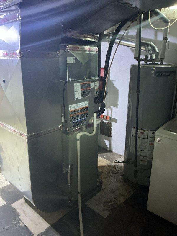 Responded to complaint of air conditioning system running continuously without cycling off. Upon arrival, found 2-month-old AC system with thermostat set to 72°F while indoor temperature reading showed 74°F. Inspected basement-located air handler and associated equipment. Diagnosed thermostat communication issue preventing proper system cycling. Verified proper operation of air handler unit and confirmed all mechanical components functioning within normal parameters. System restored to proper cycling operation with thermostat now accurately controlling temperature setpoints.