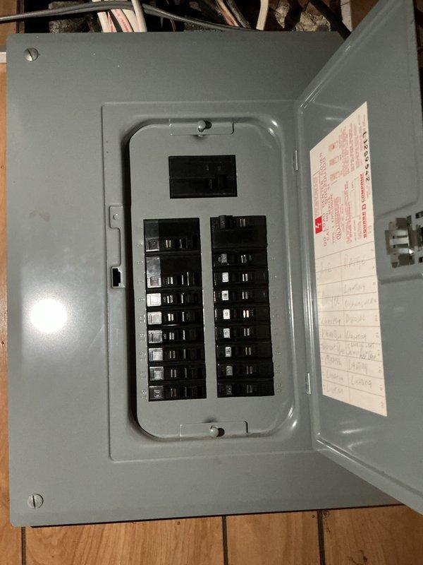 Responded to service call for 15-year-old air conditioning system that was running but not cooling. Upon inspection, confirmed unit was an R22 refrigerant system with no refrigerant charge remaining in the system. Documented existing indoor air handler and furnace configuration, as well as electrical panel setup. Due to the age of the equipment, obsolete R22 refrigerant requirement, and complete loss of refrigerant indicating likely system leak, provided estimate for full HVAC system replacement rather than repair of existing unit.