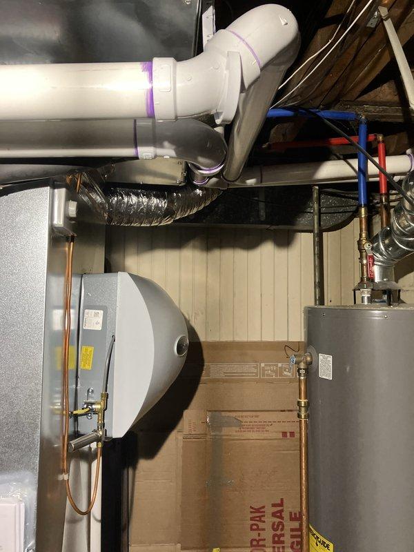 Completed full HVAC system replacement including installation of 70,000 BTU Lennox furnace, 2.5 ton air conditioning unit positioned in right side yard, Ecobee 3 Lite thermostat, humidifier, and condensate pump. All PVC venting and drain lines properly installed with secure connections, flexible ductwork routed and connected to new furnace, and existing water heater reconnected to system. Mechanical and electrical permits obtained prior to installation, all components tested and verified operational upon completion.