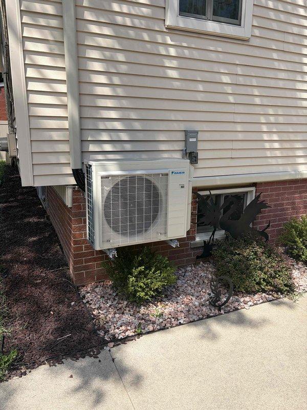 Responded to callback for persistent water leakage from basement mini split unit that was previously serviced. Inspected Daikin outdoor condenser unit and interior components for drainage issues. Performed diagnostic measurements using electronic testing equipment to identify source of continued water discharge. Verified condensate drain line function and recommended installation of condensate pump available under existing purchase order to resolve recurring drainage problem.
