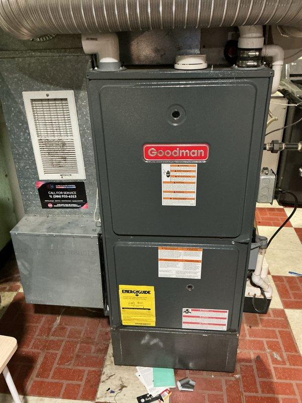 Conducted on-site evaluation of aging 2-ton air conditioning unit positioned against exterior brick wall. Unit exhibited significant weathering and deterioration consistent with end-of-service-life condition. Assessed existing outdoor condenser specifications and electrical disconnect configuration. Photographed current installation including unit positioning, electrical connections, and surrounding clearances. Evaluated interior Goodman furnace system to determine compatibility requirements for replacement outdoor unit. Customer specifically requested pricing options for economical replacement models without heat pump functionality. Provided recommendations for standard efficiency 2-ton air conditioning systems suitable for direct replacement of existing equipment.