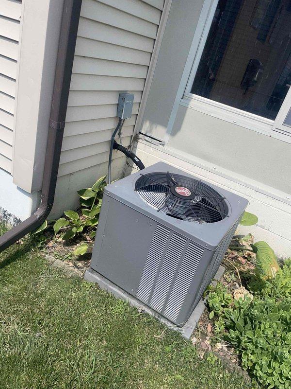 Conducted comprehensive HVAC system evaluation on 15-year-old residential air conditioning system with basement-located air handler and outdoor condenser unit. Assessed equipment condition, ductwork integrity, and overall system performance to provide replacement estimate for non-operational air conditioning system. Documented existing installation including galvanized metal ductwork configuration, air handler cabinet with associated components, and outdoor condenser unit positioned on concrete pad with proper electrical disconnect.