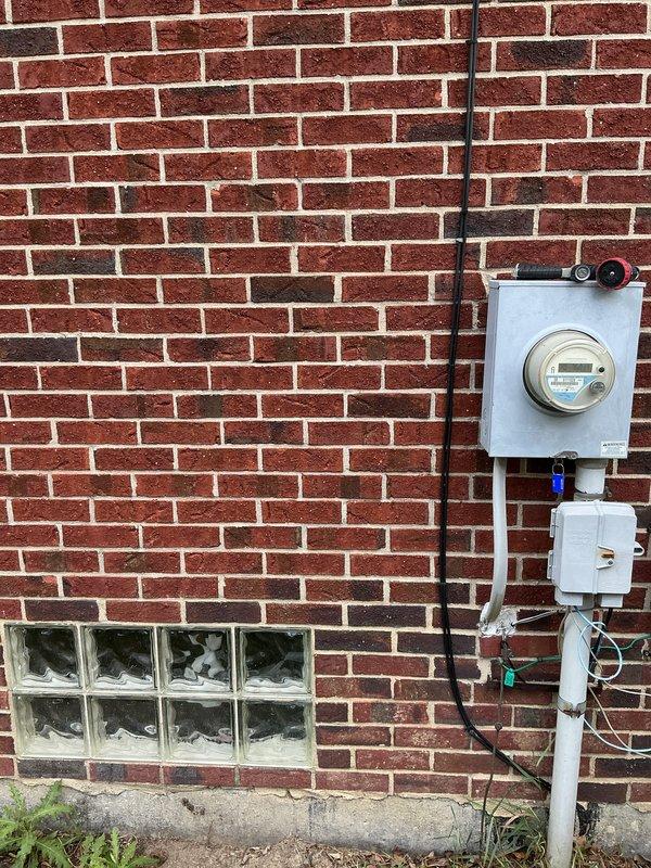Conducted site assessment for Kohler generator installation estimate at residential property. Evaluated existing electrical service configuration, meter location, and available mounting space on exterior brick wall near utility connections. Documented current electrical infrastructure including meter box placement, conduit routing, and proximity to gas line connections to determine optimal generator placement and transfer switch installation requirements.
