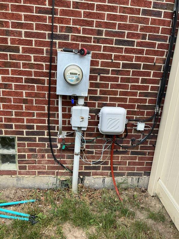 Conducted site assessment for Kohler generator installation estimate at residential property. Evaluated existing electrical service configuration, meter location, and available mounting space on exterior brick wall near utility connections. Documented current electrical infrastructure including meter box placement, conduit routing, and proximity to gas line connections to determine optimal generator placement and transfer switch installation requirements.