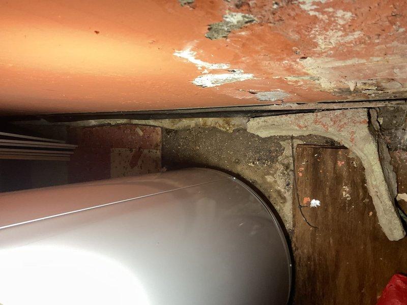 Responded to no hot water complaint at residential property. Upon arrival, conducted comprehensive inspection of tanked water heater system and associated plumbing infrastructure. Assessed water meter installation and supply line connections for proper operation and potential issues affecting hot water delivery. Examined heating unit components for signs of failure, corrosion, or deterioration that would prevent proper water heating function. Documented existing conditions including visible corrosion on metal pipes and fittings, mineral deposits on supply lines, and overall system age indicators. Verified water supply flow through meter and distribution lines. Evaluated structural mounting and connection integrity of water heating system components to ensure safe operation and identify root cause of hot water failure.