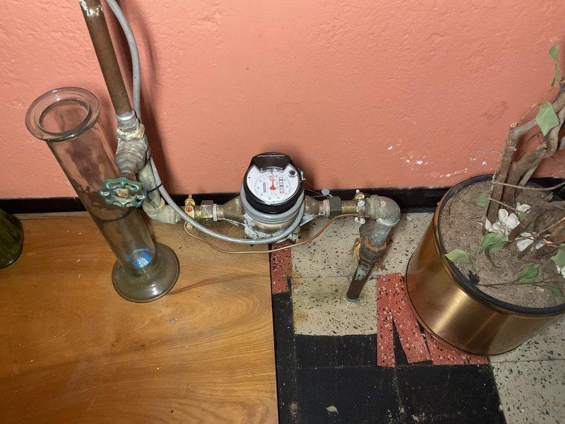 Responded to no hot water complaint at residential property. Upon arrival, conducted comprehensive inspection of tanked water heater system and associated plumbing infrastructure. Assessed water meter installation and supply line connections for proper operation and potential issues affecting hot water delivery. Examined heating unit components for signs of failure, corrosion, or deterioration that would prevent proper water heating function. Documented existing conditions including visible corrosion on metal pipes and fittings, mineral deposits on supply lines, and overall system age indicators. Verified water supply flow through meter and distribution lines. Evaluated structural mounting and connection integrity of water heating system components to ensure safe operation and identify root cause of hot water failure.