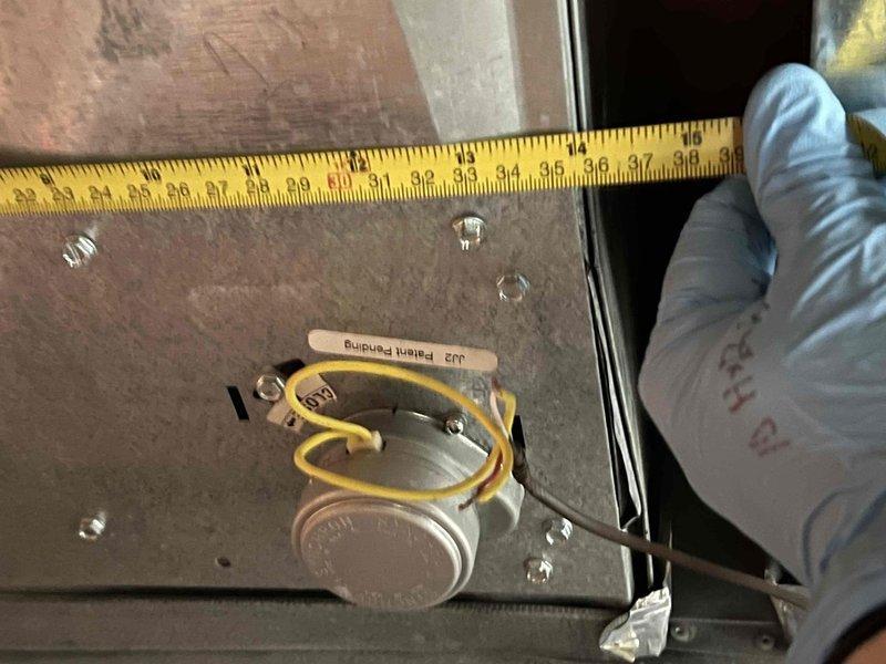 Responded to service call for uneven cooling with one side of house cold and other side warm. Inspected aging air conditioning system with outdoor condenser unit in backyard and furnace located in basement. Diagnosed zoning issue affecting temperature distribution throughout home. Measured and evaluated ductwork and damper positioning using precision measurements. Inspected Aprilaire control component and associated wiring connections within the HVAC system. Verified electrical connections and wire terminations at zone control panel. Assessed damper actuator functionality and mechanical operation. System tested after adjustments to restore balanced airflow and proper temperature control to all zones of residence.