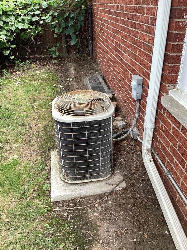 Conducted comprehensive assessment of residential HVAC and water heating systems for replacement estimate. Evaluated 30-year-old furnace located in basement with existing ductwork infrastructure, outdoor air conditioning unit showing weathering and age-related deterioration, and basement water heater with copper piping connections. Documented equipment conditions, measured existing installations, photographed all units and surrounding infrastructure including electrical disconnects, refrigerant lines, and ventilation systems to provide accurate replacement specifications and equipment sizing recommendations.