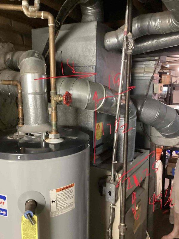 Conducted comprehensive assessment of residential HVAC and water heating systems for replacement estimate. Evaluated 30-year-old furnace located in basement with existing ductwork infrastructure, outdoor air conditioning unit showing weathering and age-related deterioration, and basement water heater with copper piping connections. Documented equipment conditions, measured existing installations, photographed all units and surrounding infrastructure including electrical disconnects, refrigerant lines, and ventilation systems to provide accurate replacement specifications and equipment sizing recommendations.