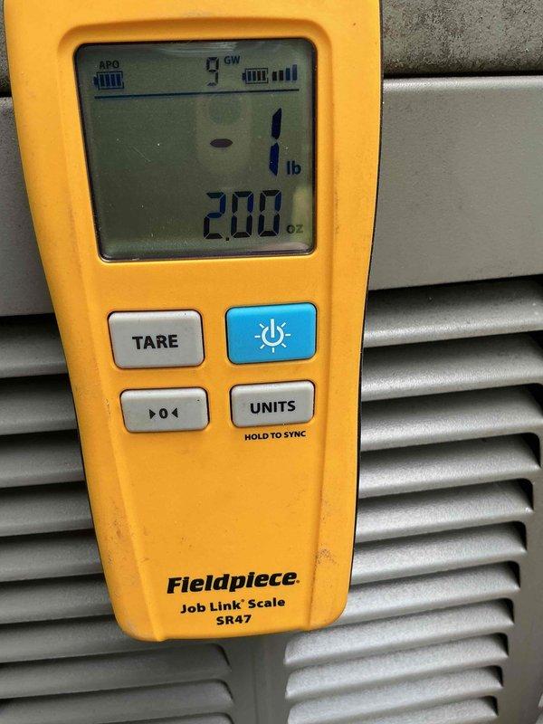 Performed comprehensive AC tune-up on 6-year-old Lennox condensing unit located in backyard. Conducted full system inspection including visual assessment of cabinet condition, checked electrical connections and conduit, verified proper unit leveling on concrete pad, and inspected condenser coil through louvers. Measured refrigerant charge using digital scale to ensure system operating at manufacturer specifications. Unit found in good operating condition with no issues identified. System operating efficiently with all components functioning within normal parameters.