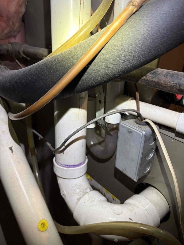 Completed comprehensive Gold AC Inspection on outdoor condensing unit approximately 4-5 years old. Performed full system evaluation including visual inspection of condenser coil fins, fan motor operation, and electrical connections at disconnect box. Verified refrigerant lines and insulation integrity on both interior and exterior components. Inspected indoor evaporator coil assembly, condensate drain system with PVC piping, and associated electrical junction box connections. All components operating within normal parameters with no deficiencies noted. System tested under load and confirmed proper cycling and temperature differential. Unit maintained in good working condition with no repairs required at this time.