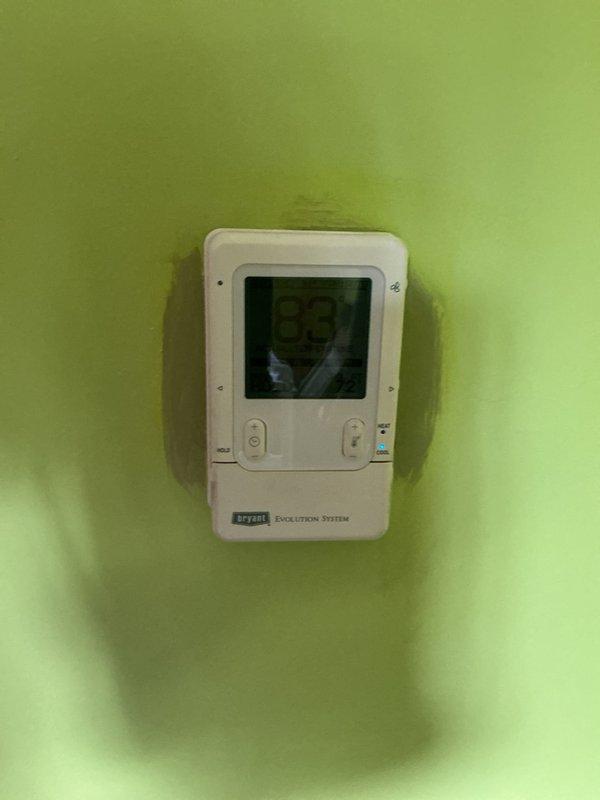 Responded to no cooling complaint with "system malfunction" error displayed on Bryant Evolution thermostat located in sunroom. Performed diagnostic testing of A/C system using manifold gauges to measure refrigerant pressures and temperatures across the system. Identified thermostat communication fault as root cause of system malfunction message, preventing normal cooling operation. Cleared error codes, verified proper system operation, and confirmed unit returned to normal cooling function with all parameters within manufacturer specifications.