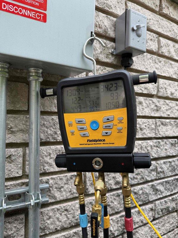 Responded to no cooling complaint with "system malfunction" error displayed on Bryant Evolution thermostat located in sunroom. Performed diagnostic testing of A/C system using manifold gauges to measure refrigerant pressures and temperatures across the system. Identified thermostat communication fault as root cause of system malfunction message, preventing normal cooling operation. Cleared error codes, verified proper system operation, and confirmed unit returned to normal cooling function with all parameters within manufacturer specifications.