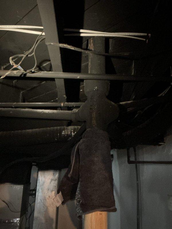 Responded to service call for cracked pipe stack in basement mechanical room. Upon inspection, identified compromised vertical stack with visible cracking requiring replacement. Removed damaged section of pipe stack and installed new stack assembly, ensuring proper alignment with existing plumbing infrastructure and HVAC ductwork in confined space. Tested system for leaks and verified proper drainage flow upon completion.